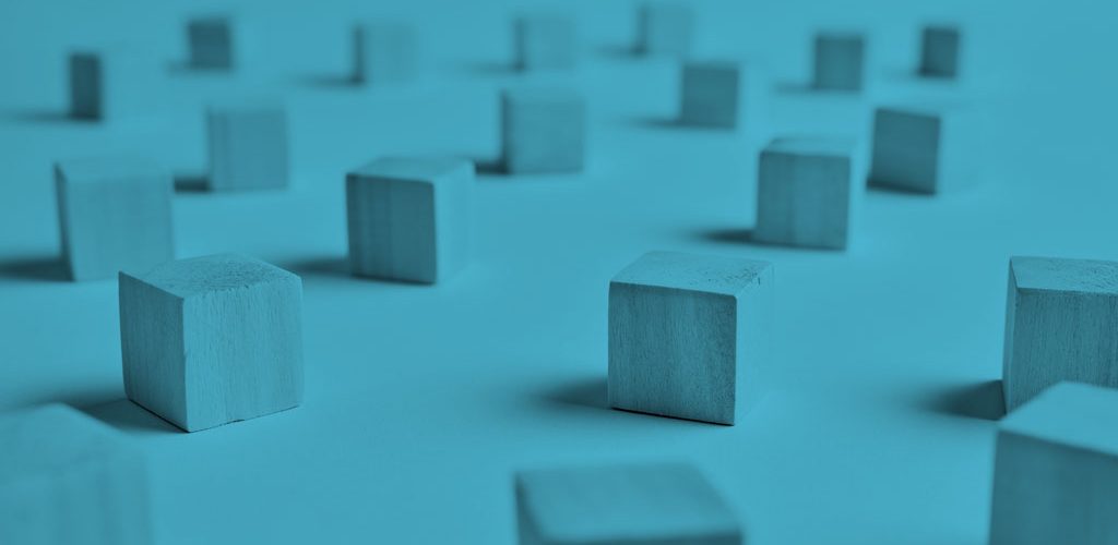 wooden blocks sitting apart on a table
