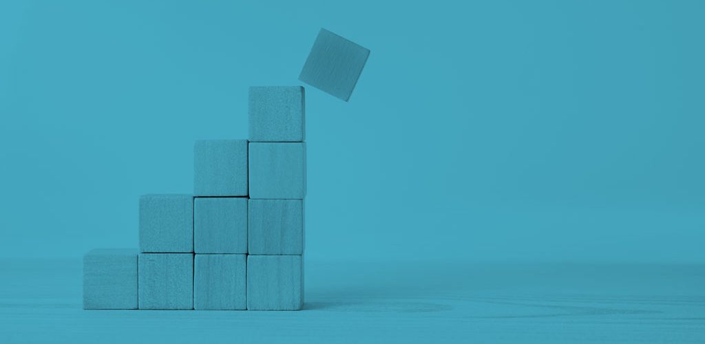 wooden blocks stacked in a pyramid shape