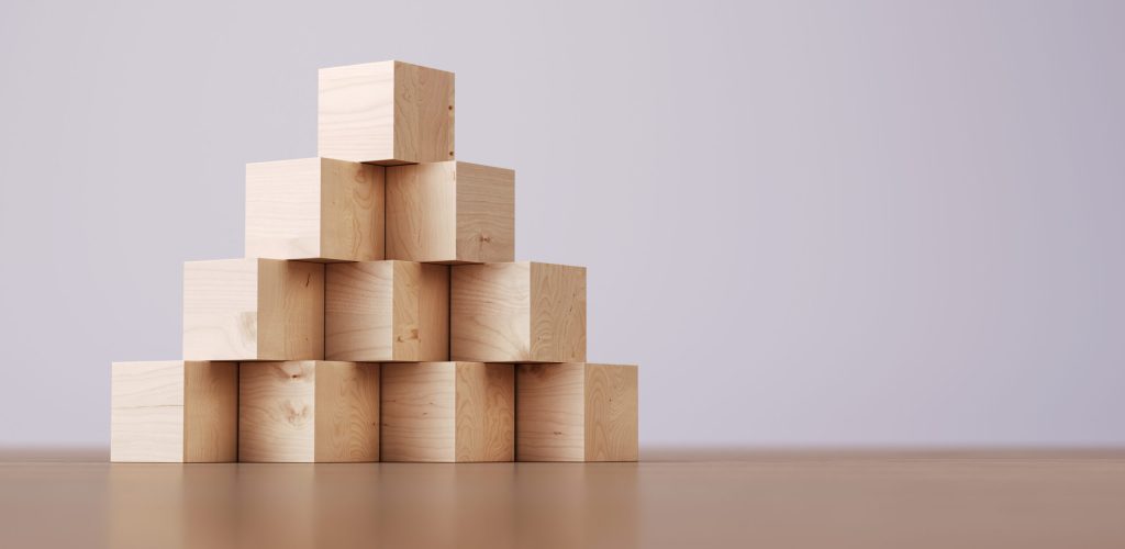 Pyramid Made of Wooden Blocks 3d Render Pyramid Made of Wooden Blocks, Success, business, Growth Concept. (Depth Of Field)